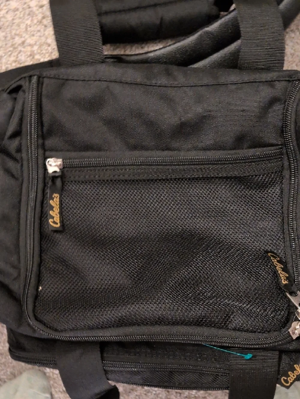 Cabela's Black Duffel Bag with Gold Logo and Adjustable Strap